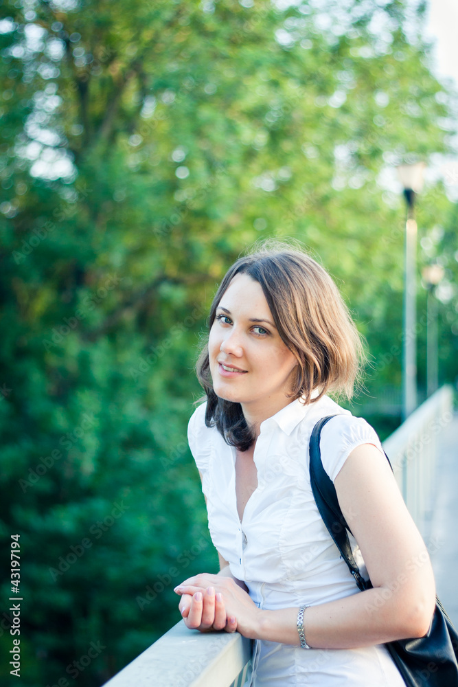Portrait of a beautiful young woman outdoors in a park Portrait of a beautiful young woman outdoors in a park