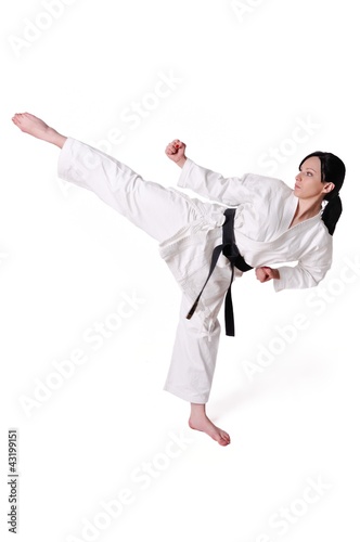 Karate woman posing on a white background