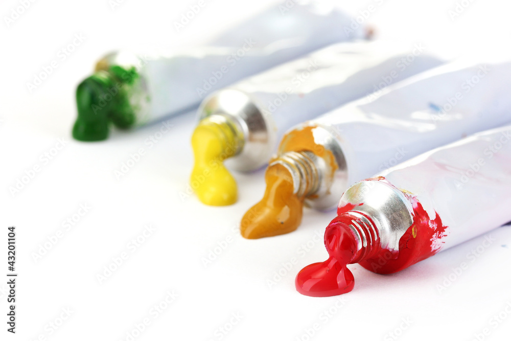 Abstract acrylic paint in tubes isolated on white