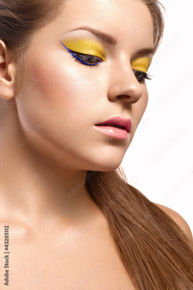 beautiful girl with a bright lemon-colored make-up beautiful girl with a bright lemon-colored make-up