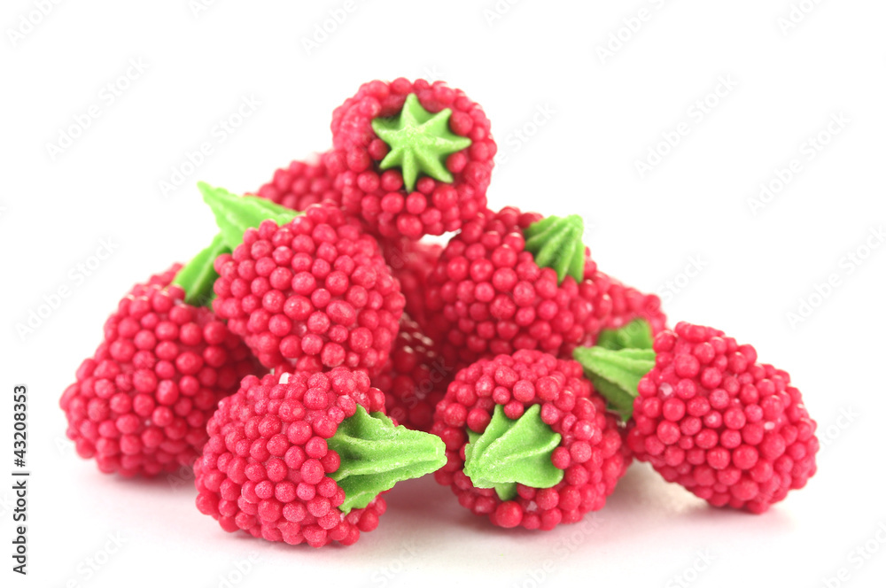 red candy raspberries isolated on white red candy raspberries isolated on white