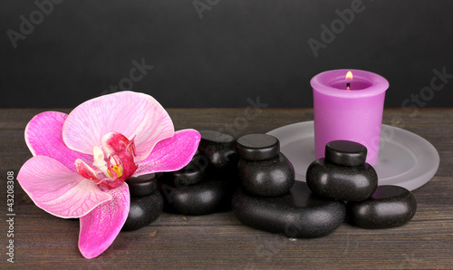 Spa stones with orchid flower and candle