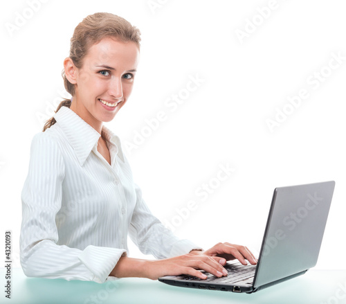 friendly administrative assistant at the desk with a laptop