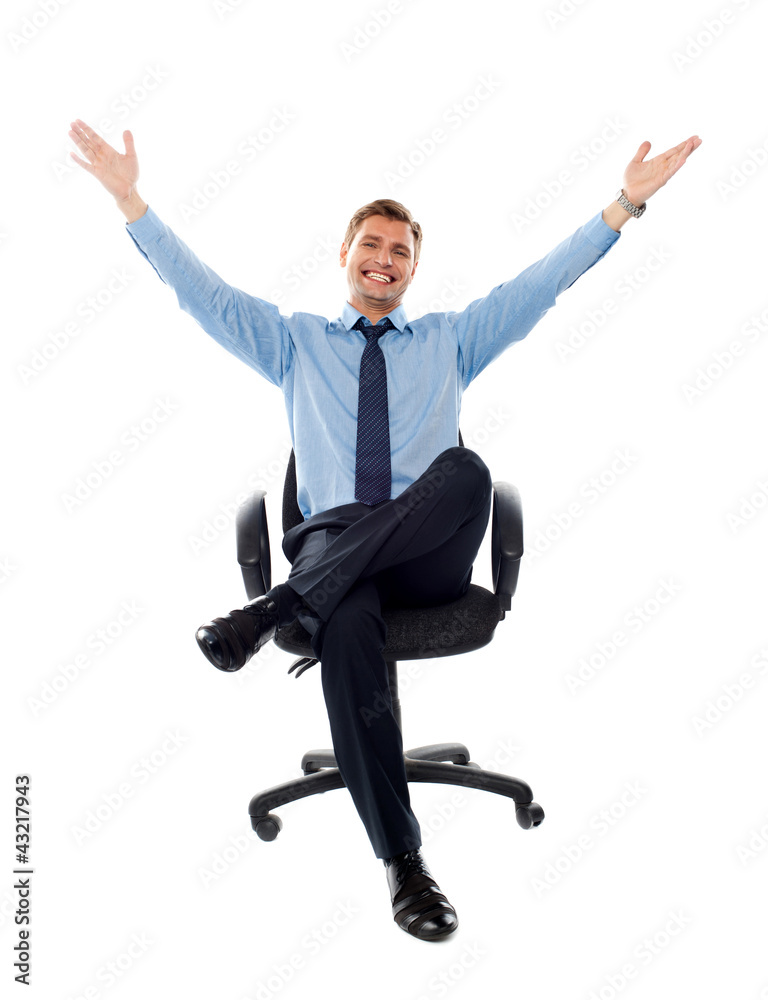 Successful businessman seated on chair