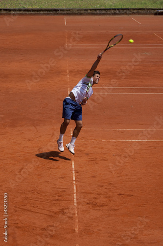 tennis player at the service © Composer