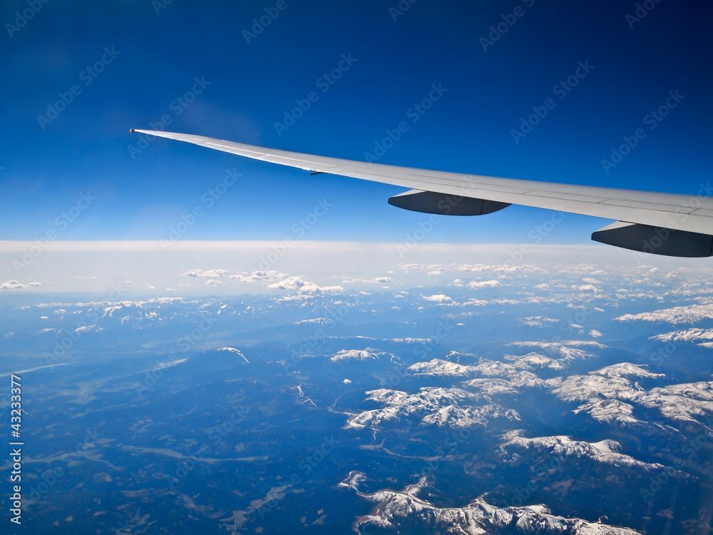 Obraz premium air plane wing and blue sky