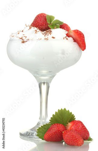 glass of ripe strawberries with cream isolated on white