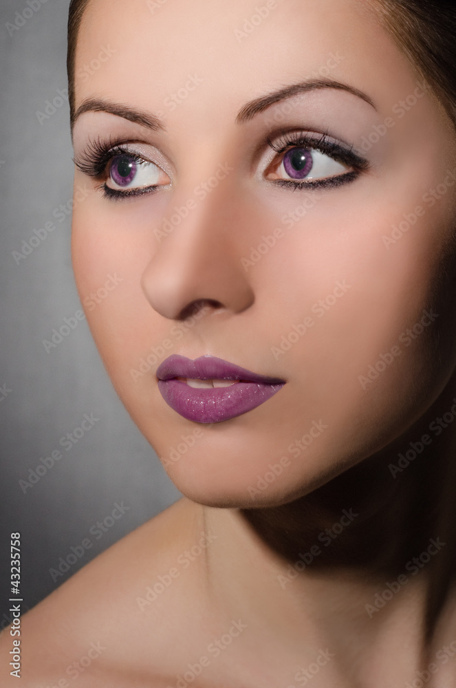Portrait of beautiful girl with violet eyes