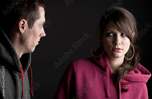 Teenagers against Dark Background