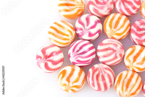 striped fruit candies isolated on white