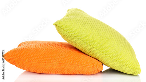 Bright color pillows isolated on white © Africa Studio