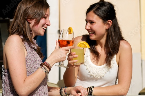 Two Girls While They Take a Cocktail