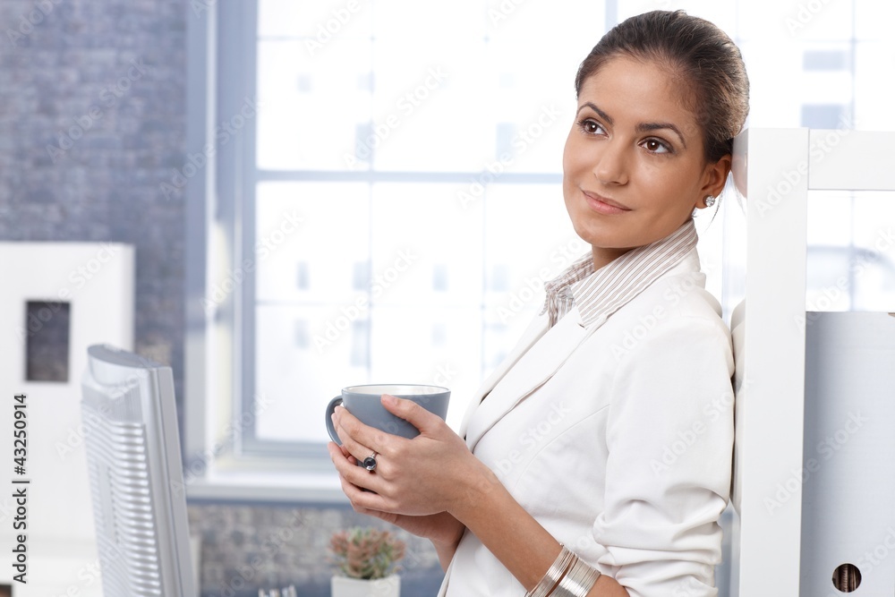 Businesswoman drinking tea