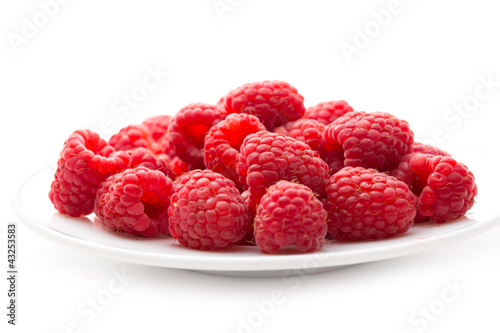 Fresh raspberry on white plate