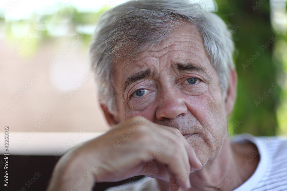 Closeup portrait of an old man outdoor