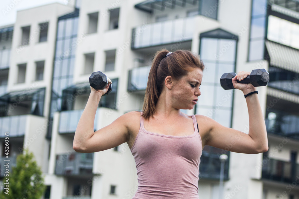 Sensual girl keep fit in a urban landscape