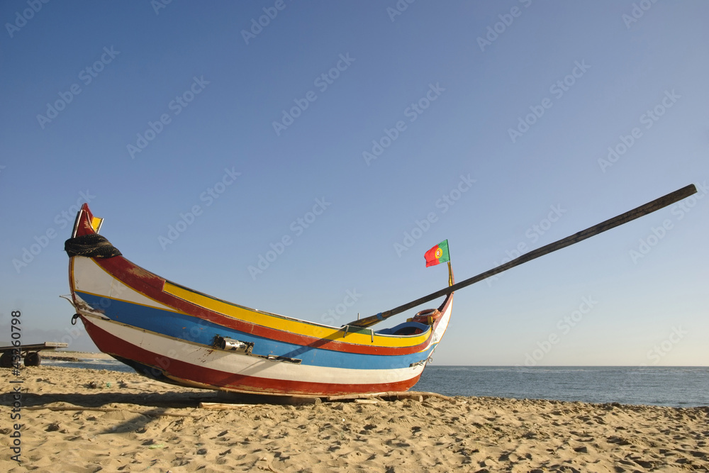 Typical portuguese fishing boat on the beach, Espinho, Portugal Typical portuguese fishing boat on the beach, Espinho, Portugal