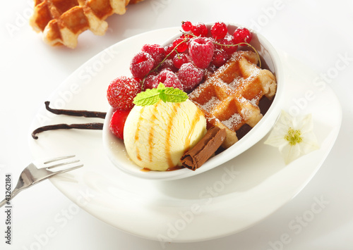 Waffle with icecream and berries photo