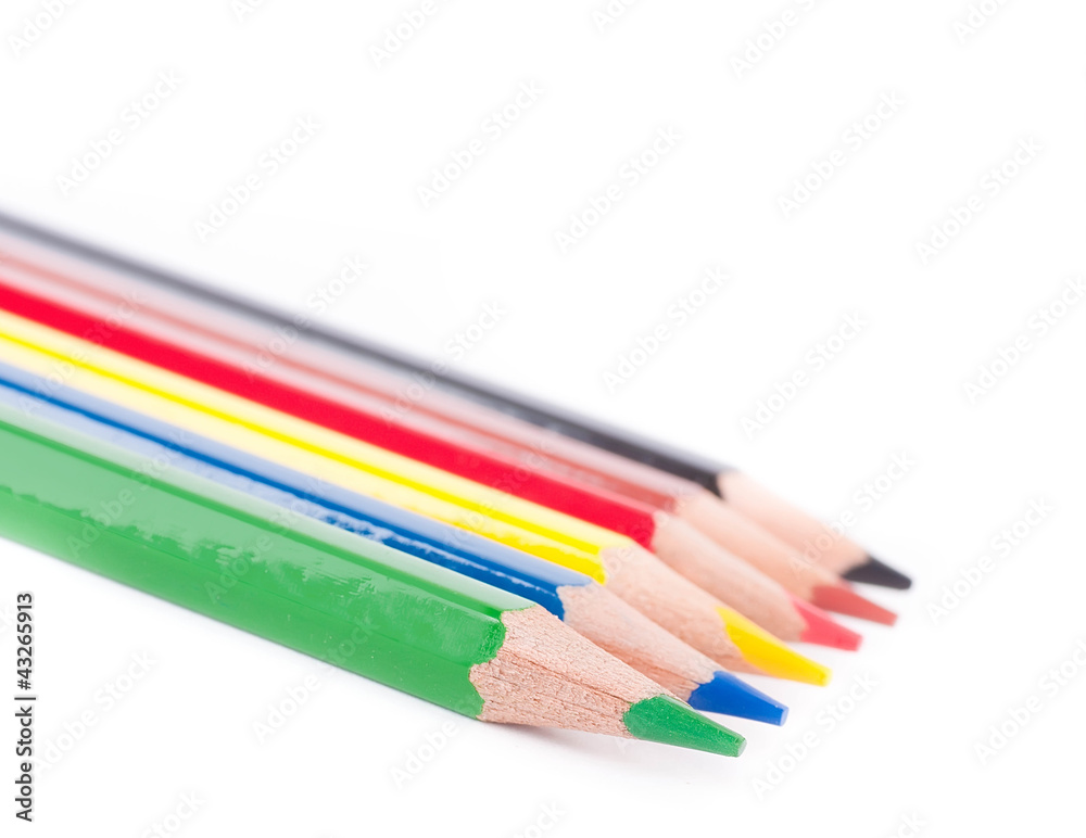 Crayons on a white background, school belongings