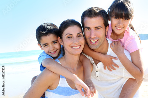 Closeup of happy family at the beach