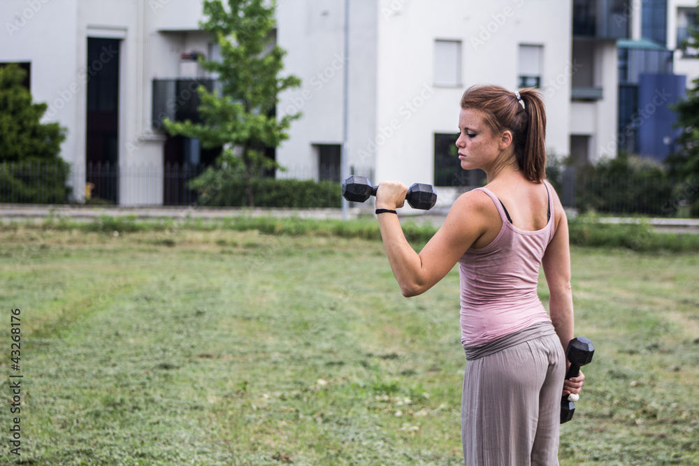Sensual girl keep fit in a urban landscape