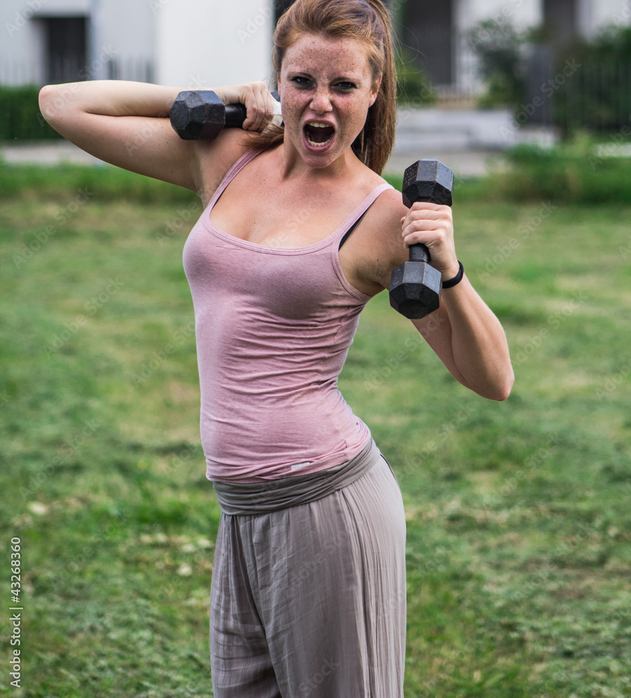 Sensual girl keep fit in a urban landscape