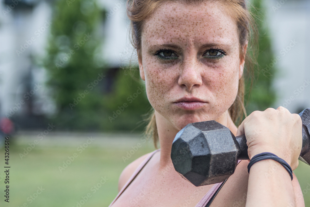 Sensual and angry girl keep fit in a urban landscape