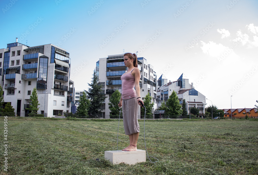 Sensual girl keep fit in a urban landscape