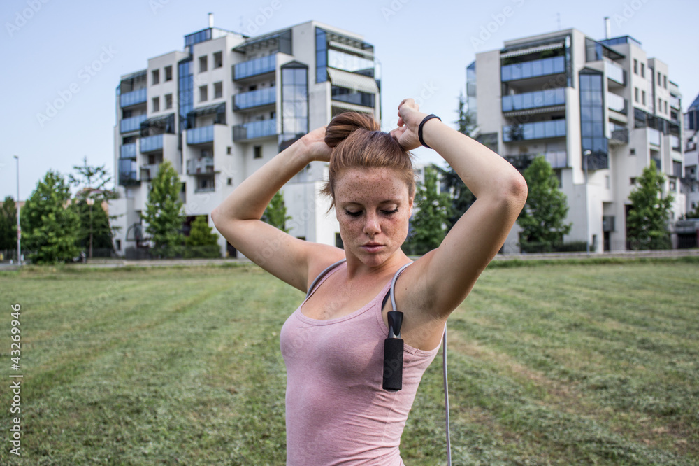 Sensual girl keep fit in a urban landscape