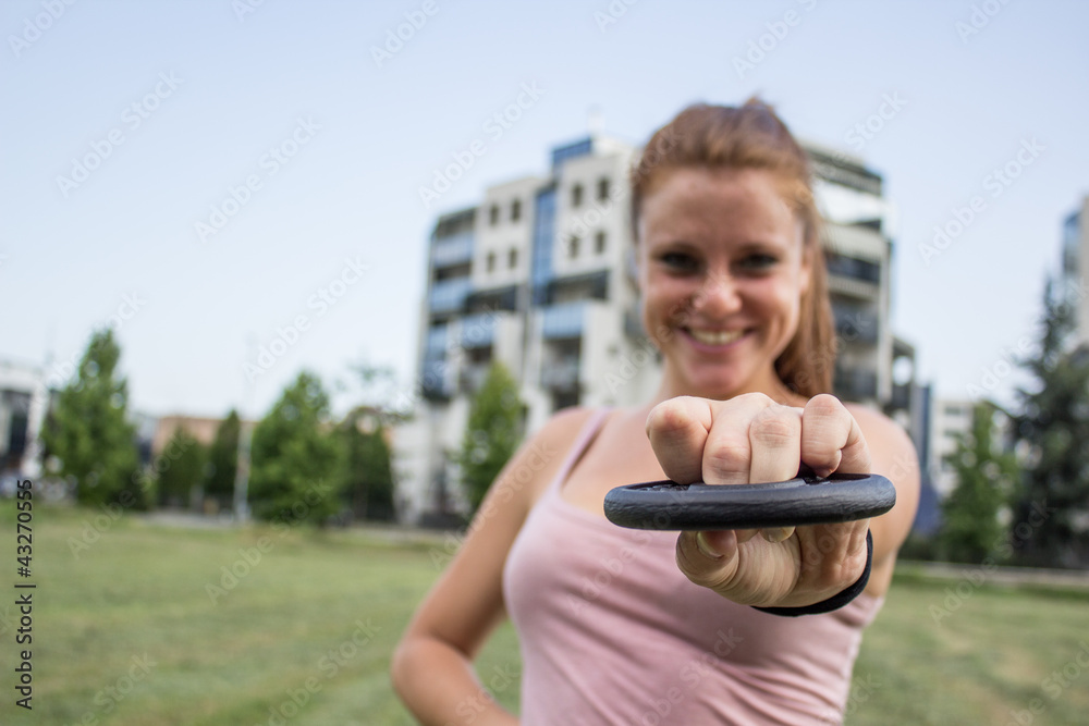 Sensual girl keep fit in a urban landscape