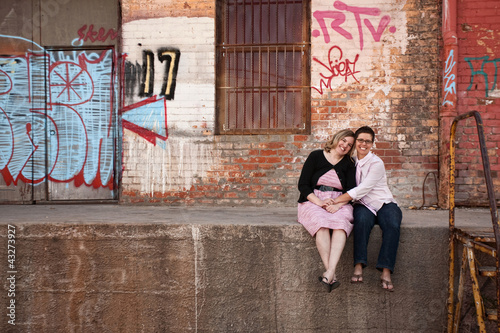 Portrait of smiling couple sitting at dock © Scott Griessel