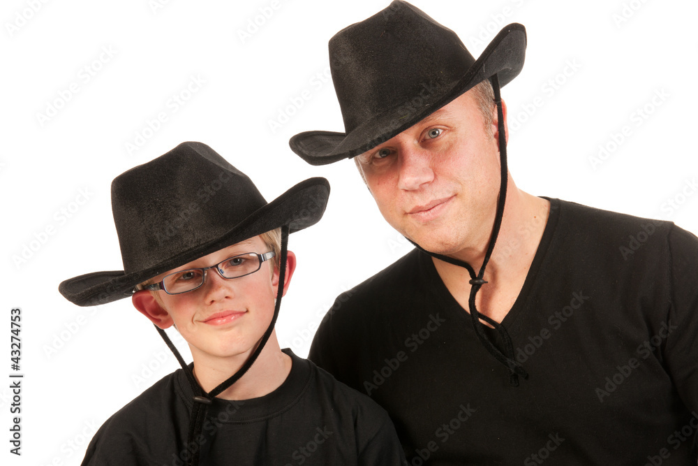 man and child with cowboy hats man and child with cowboy hats