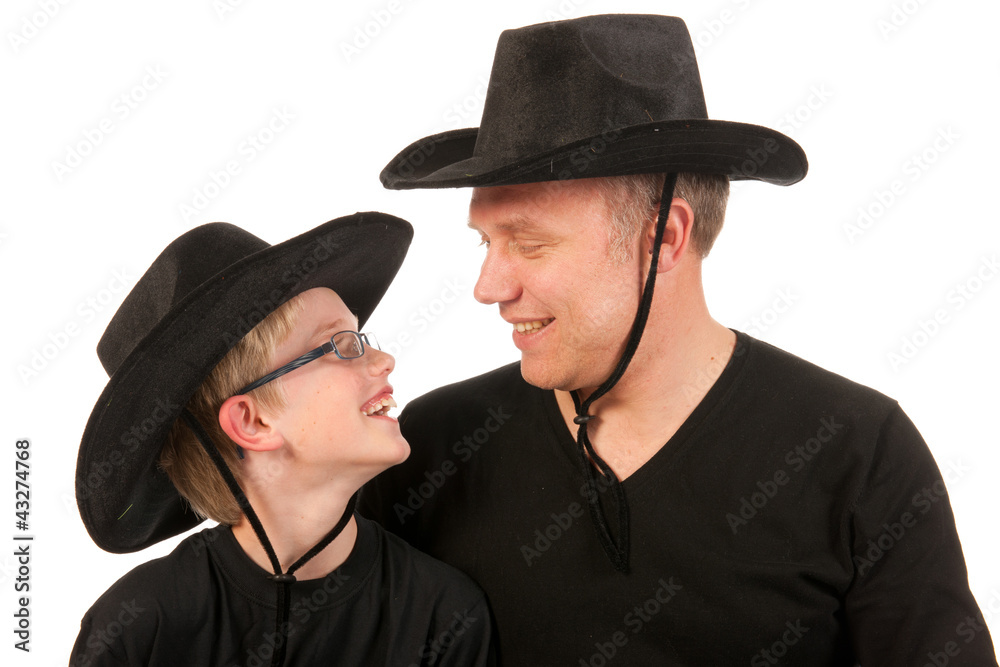 man and child with cowboy hats man and child with cowboy hats