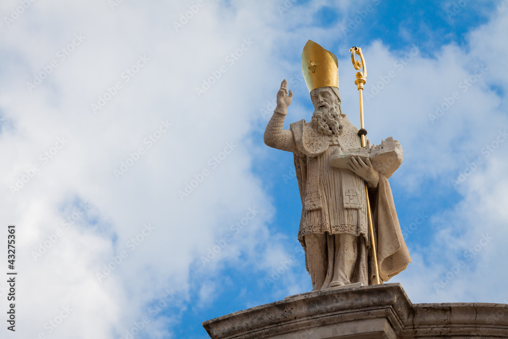 Naklejka premium A statue of St. Blaise holding a model of Dubrovnik