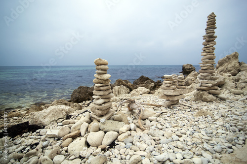 Two pyramids from stones on the seashore