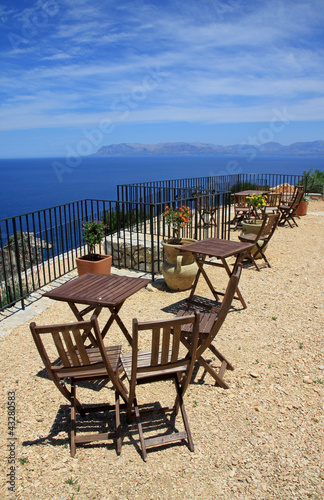 Table and chairs with a fantastic landscape