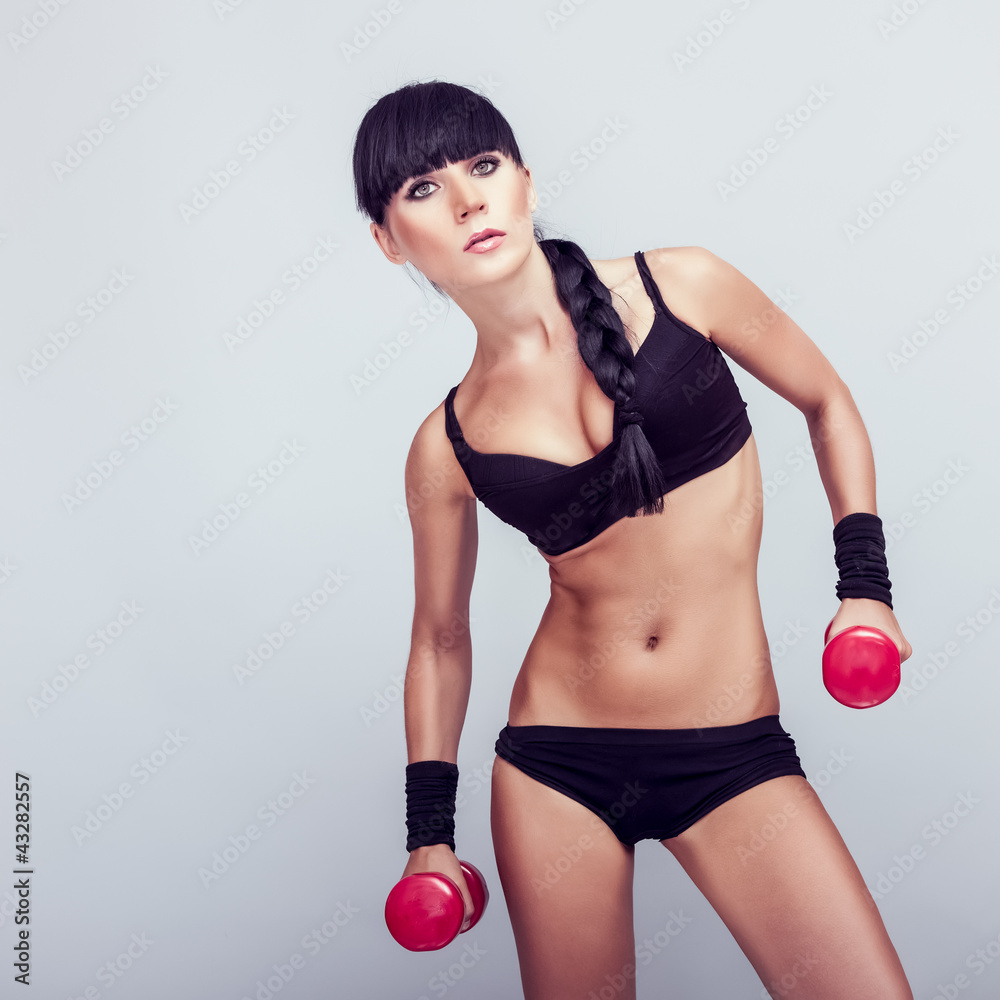 Fototapeta premium fitness woman working out with dumbbell