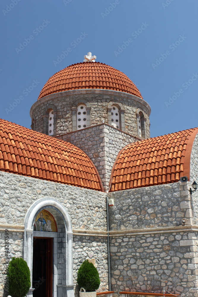  stone monastery with terracotta dome on the greek island of kalymnos