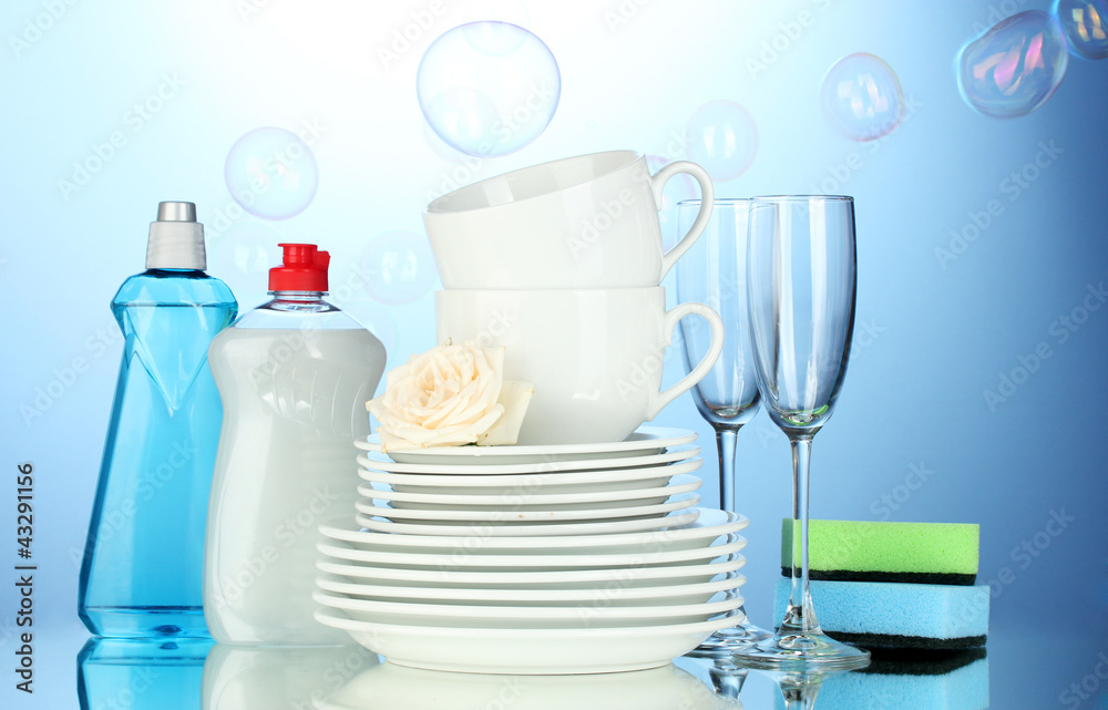 Fototapeta premium empty clean plates, glasses and cups with dishwashing liquid