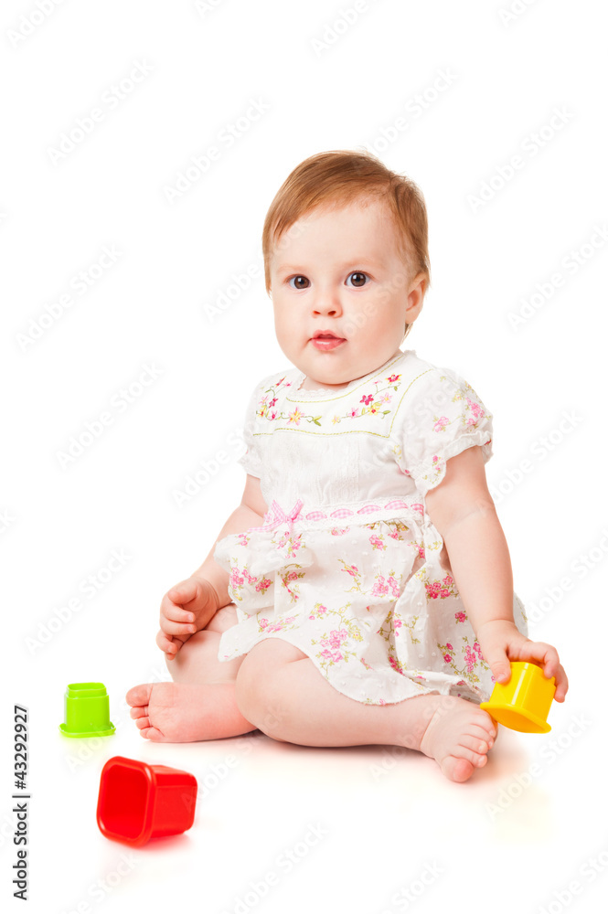 Little girl with a toys, isolated on white Little girl with a toys, isolated on white