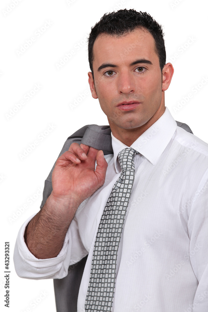 Confident businessman with jacket over shoulder Confident businessman with jacket over shoulder