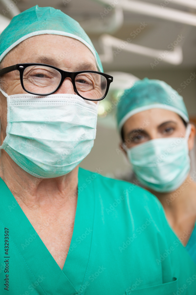 Man surgeon with glasses and a colleague Man surgeon with glasses and a colleague