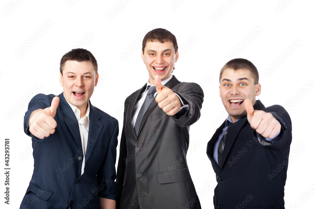 Three young  business men laughing and giving the thumbs up sign
