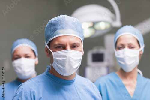 Medical team looking at camera photo