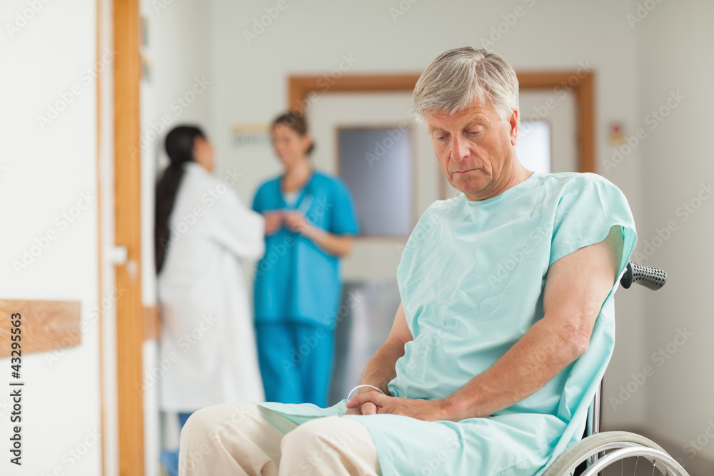 Obraz premium Patient in a wheelchair looking down