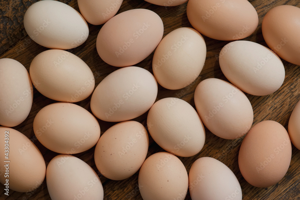 Brown eggs at wooden table background. Shallow depth of field Brown eggs at wooden table background. Shallow depth of field