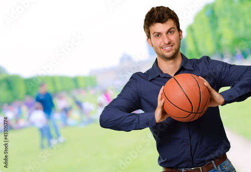 Portrait Of Young Man Holding Basketball © Krakenimages.com