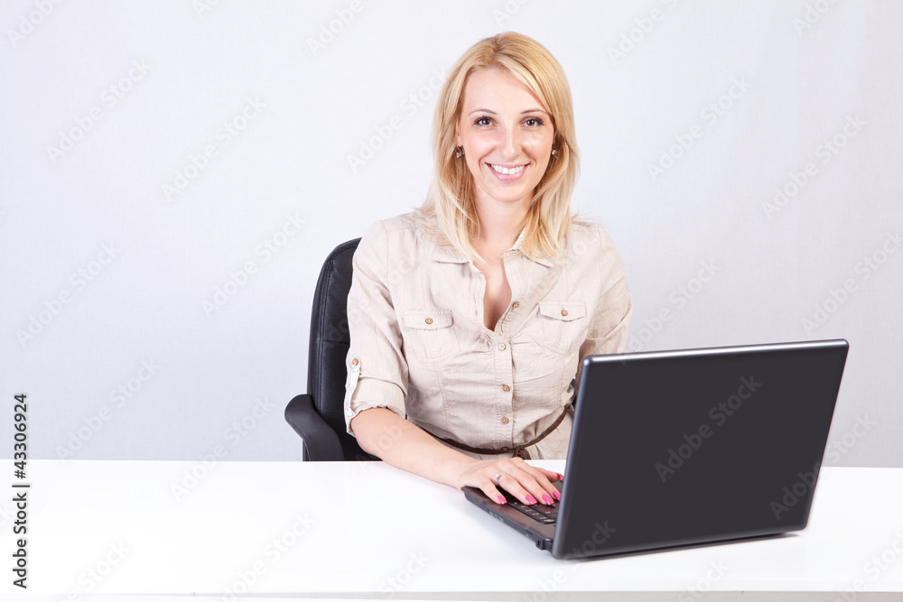 young blond girl sitting in front of computer young blond girl sitting in front of computer