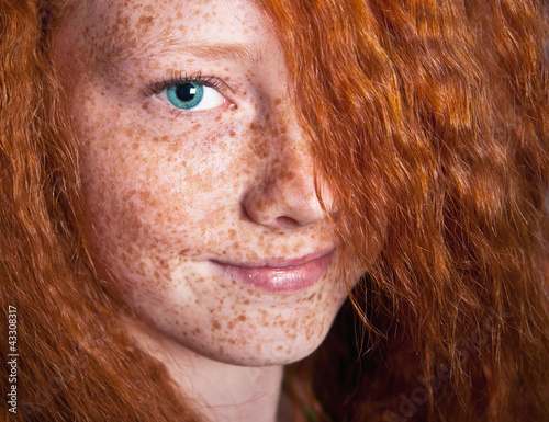 Smilig freckled girl photo