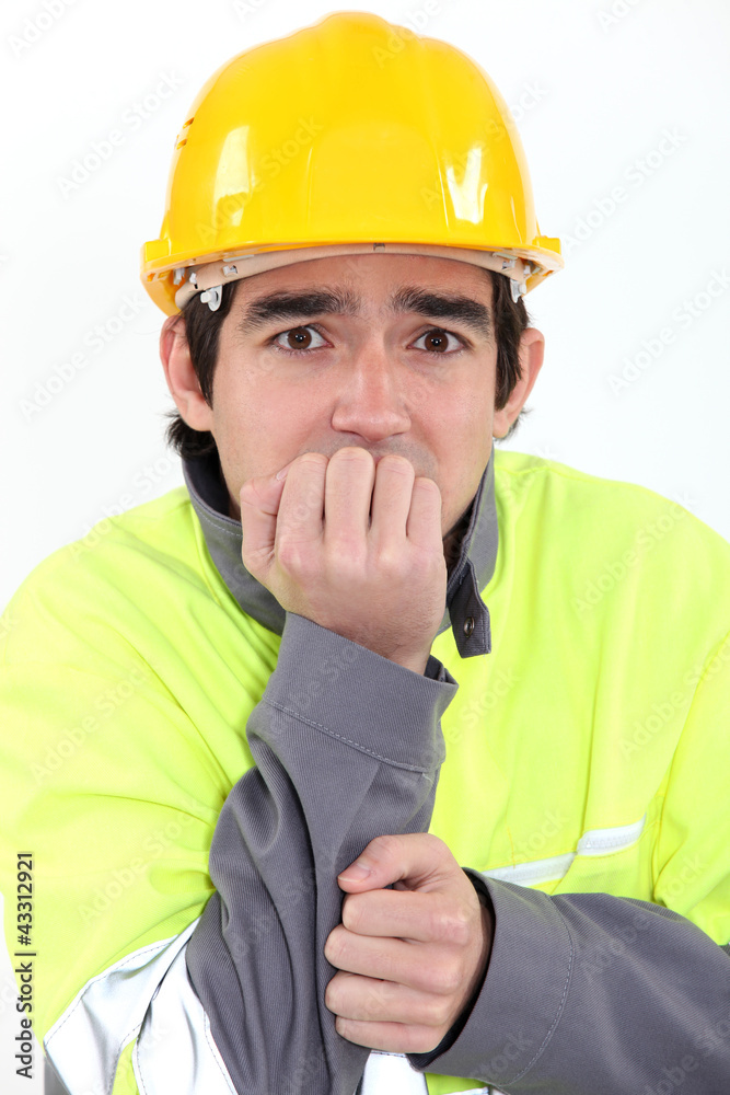 Fearful young worker Fearful young worker